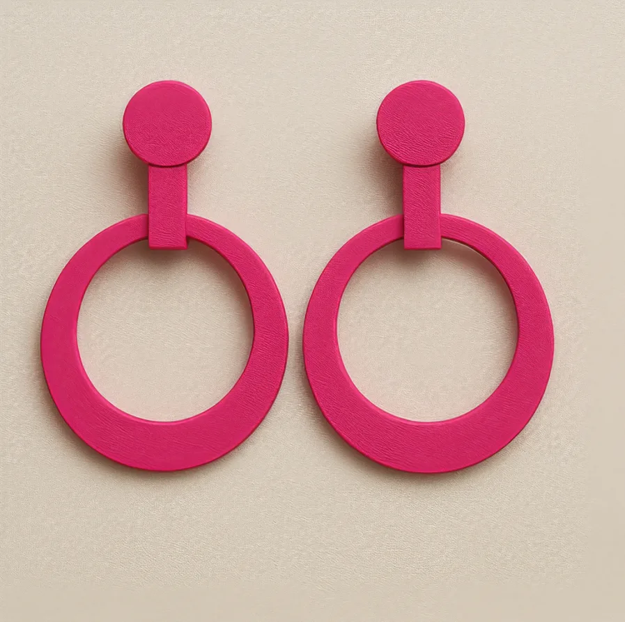 Red hoop earrings with circular top and open ring design