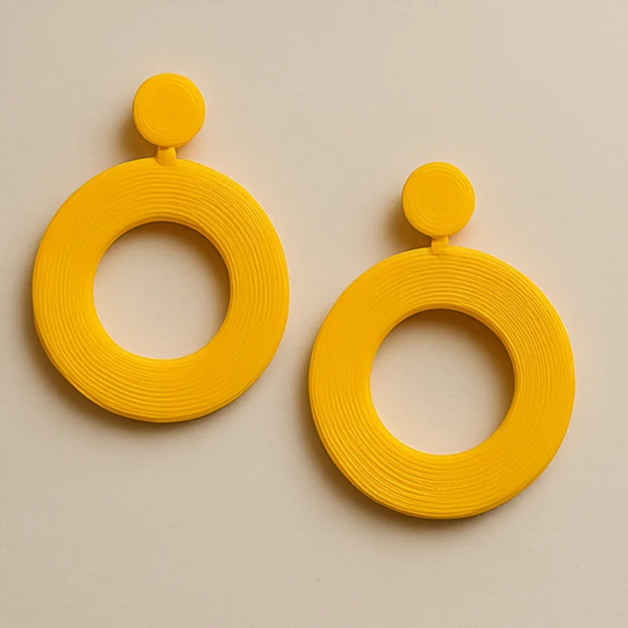 Circular stud earrings with bold yellow hoop silhouette