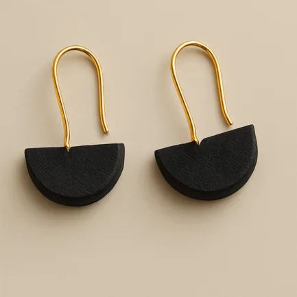 Earrings with black half-circle design and gold hooks