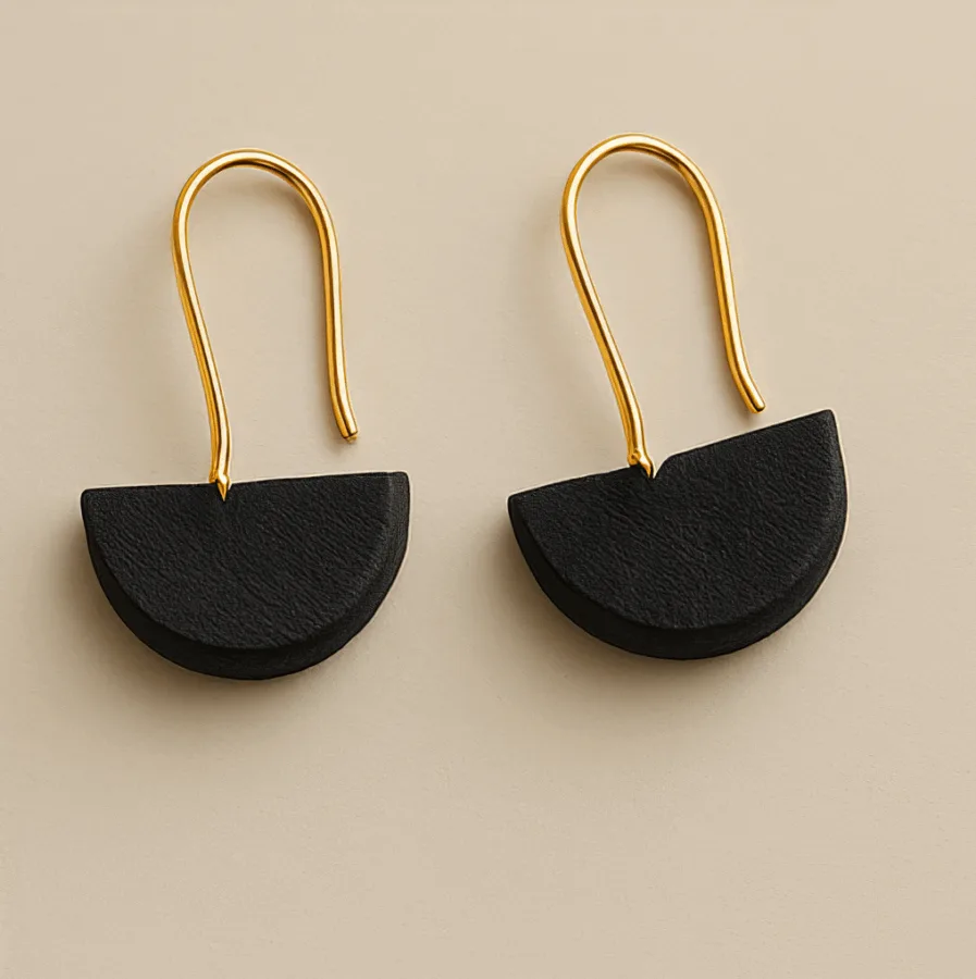 Earrings with black half-circle design and gold hooks