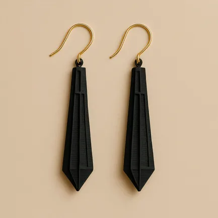 Long gold dangle drop earrings in matte black with sculpted 3D printed finish