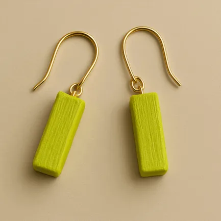 Small gold dangle earrings with neon green rectangular charm