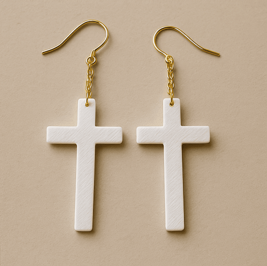 White cross dangle earrings with gold hook and lightweight matte finish