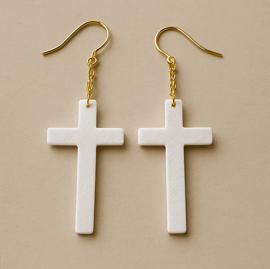 White cross dangle earrings with gold hook and lightweight matte finish