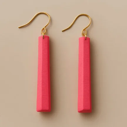 Long pink dangle earrings with gold fish-hook and sculpted matte finish