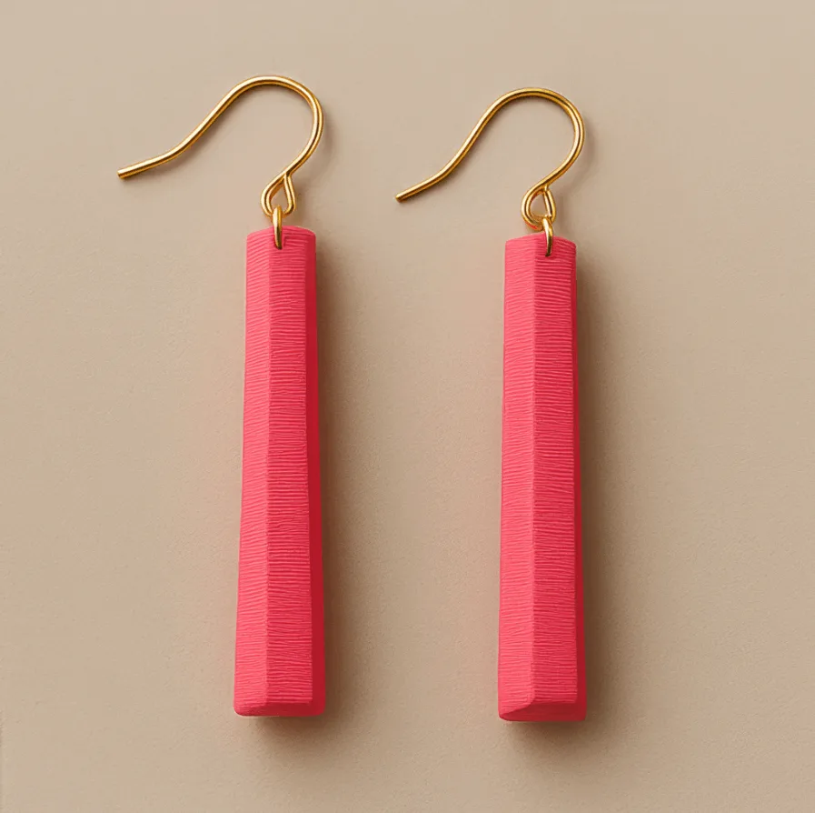 Long pink dangle earrings with gold fish-hook and sculpted matte finish