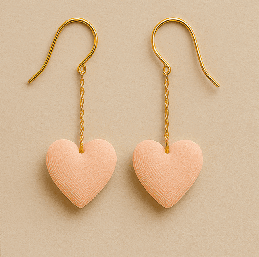 Pink heart earrings with gold chain drop and 3D printed texture