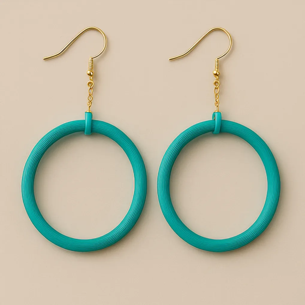 Turquoise dangle hoop earrings with gold hooks and circular matte frame Turquoise dangle hoop earrings with gold hooks and circular matte frame
