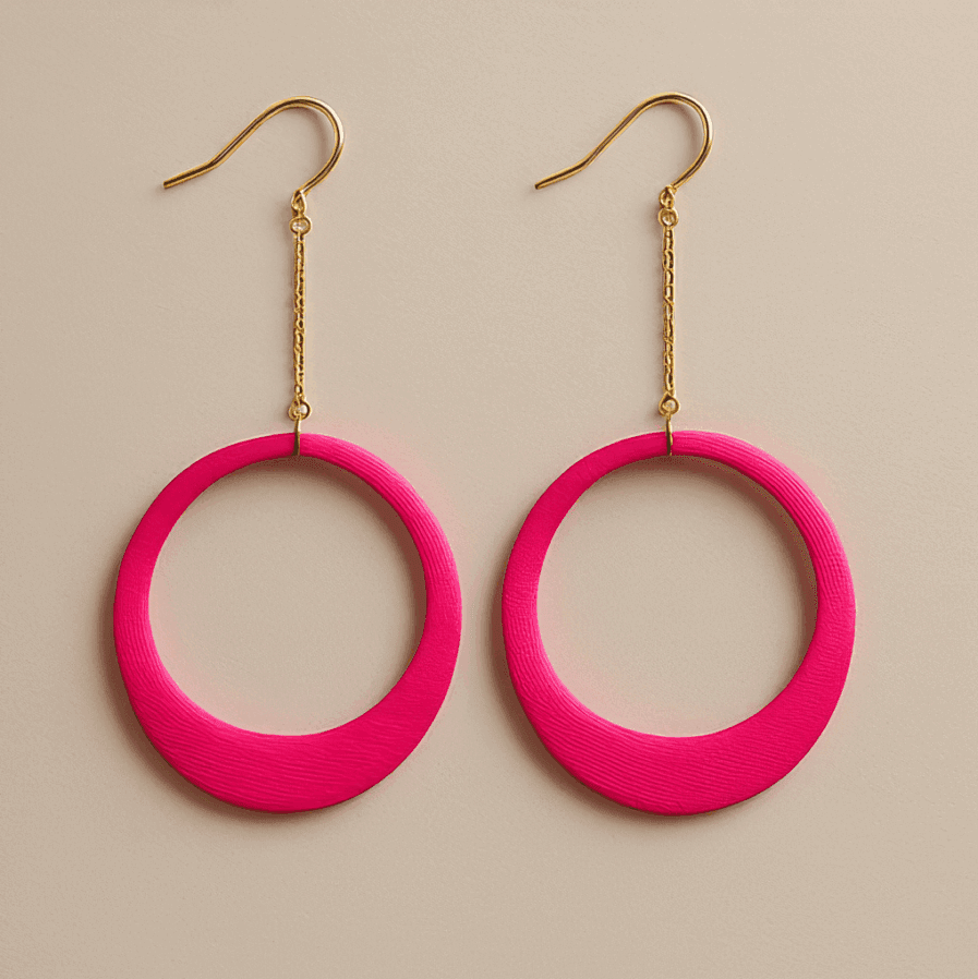 Pink hoop dangle earrings with chain detail and sculptural matte finish