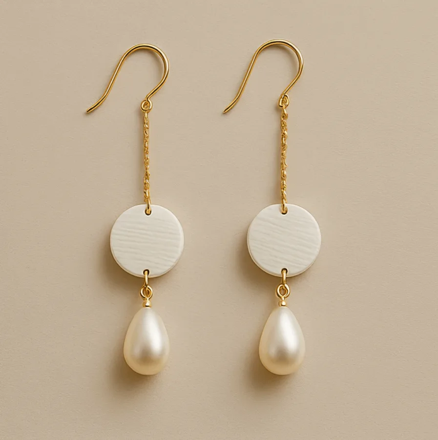 Dangle pearl earrings with ivory disc and gold hook design