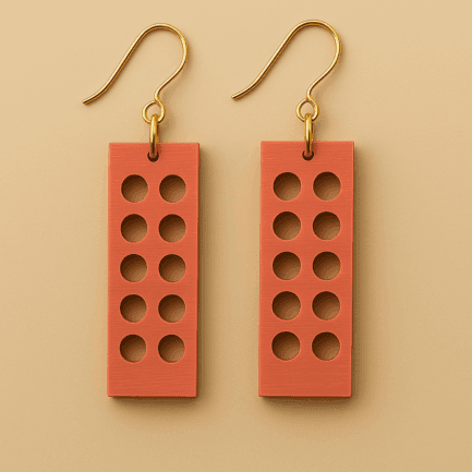 Brick earrings in terra red with perforated geometric shape