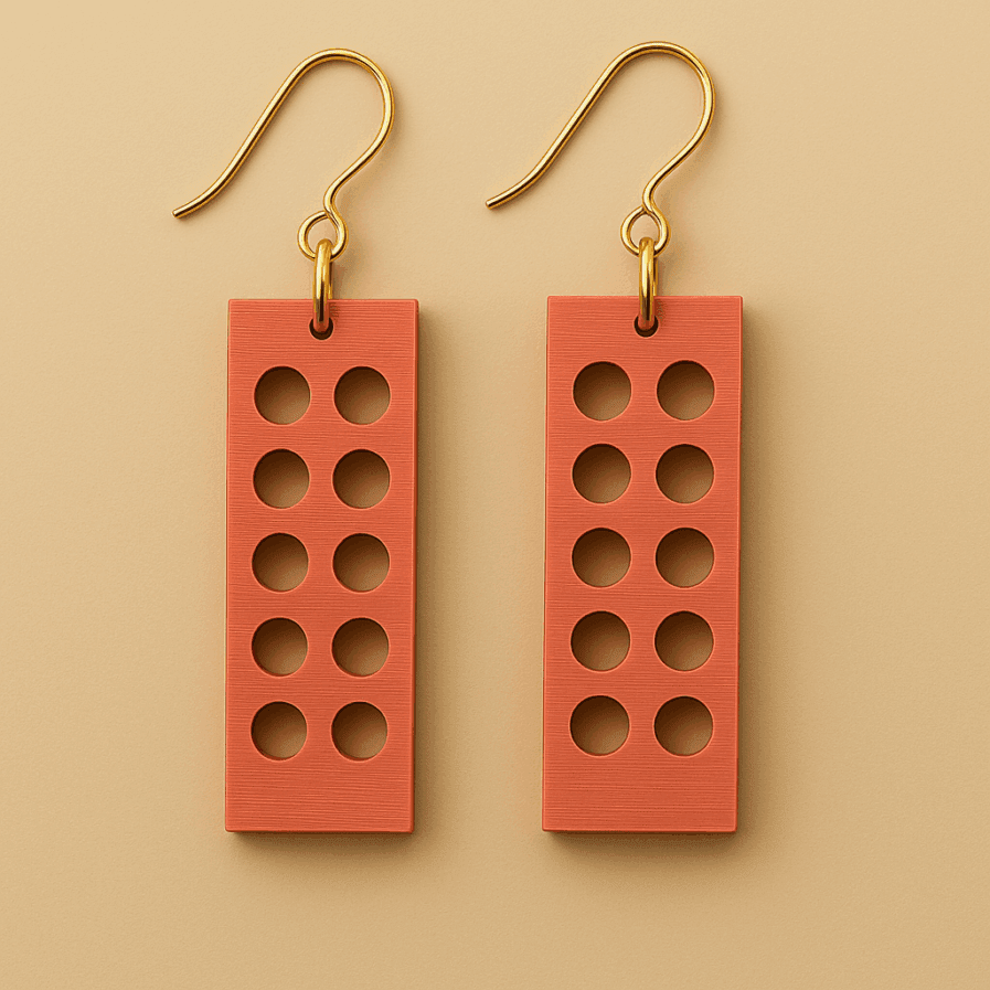 Brick earrings in terra red with perforated geometric shape