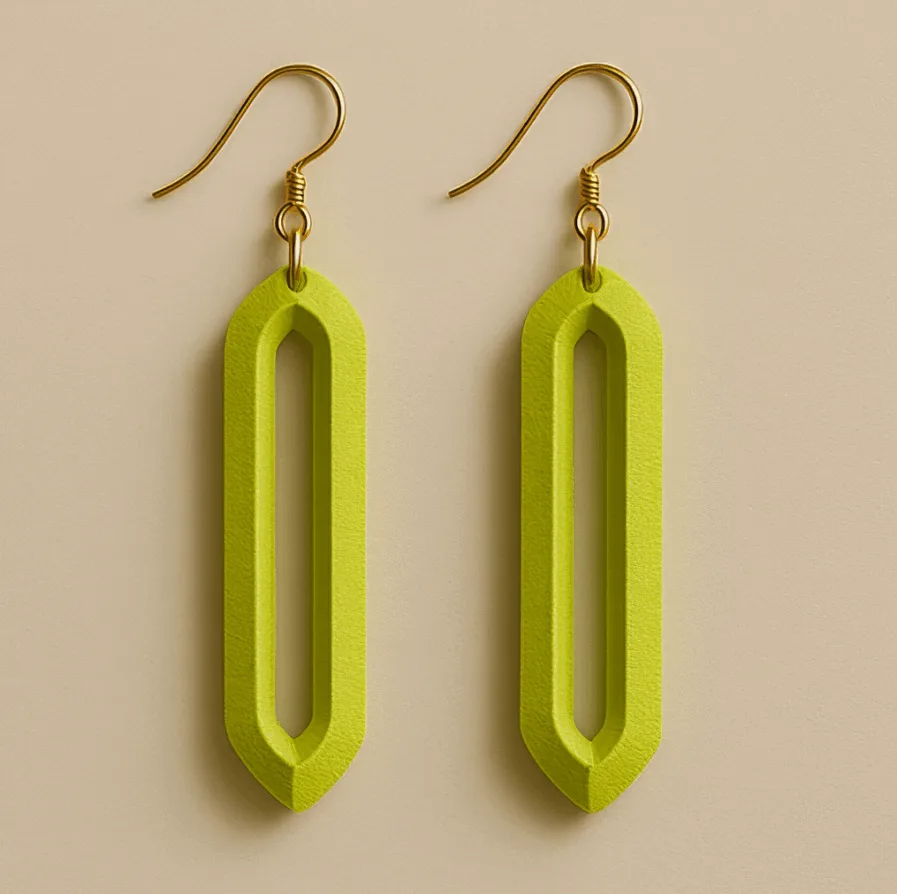 Long dangle earrings in neon yellow-green with geometric hollow design