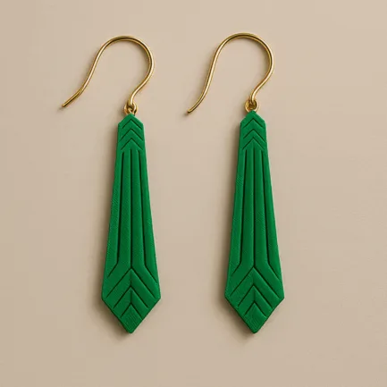Green statement earrings with geometric arrow shape