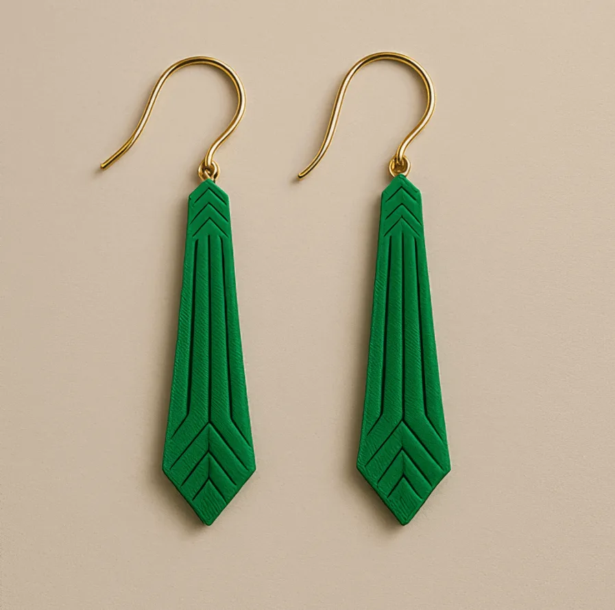 Green statement earrings with geometric arrow shape