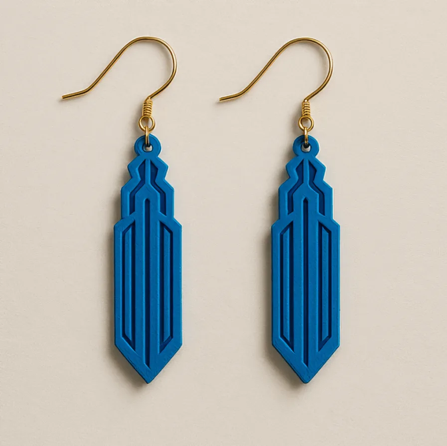 Art Deco earrings in bold blue with spire-shaped silhouette