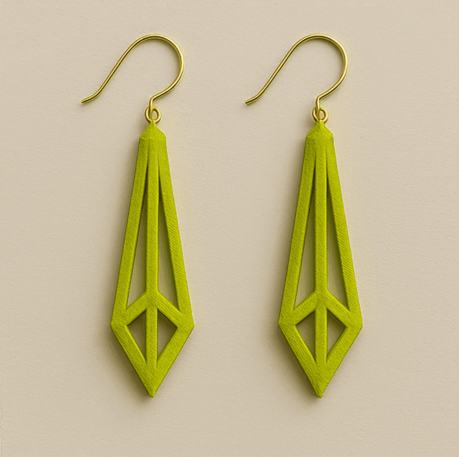 Bright green long gold dangle earrings with geometric openwork 3D design