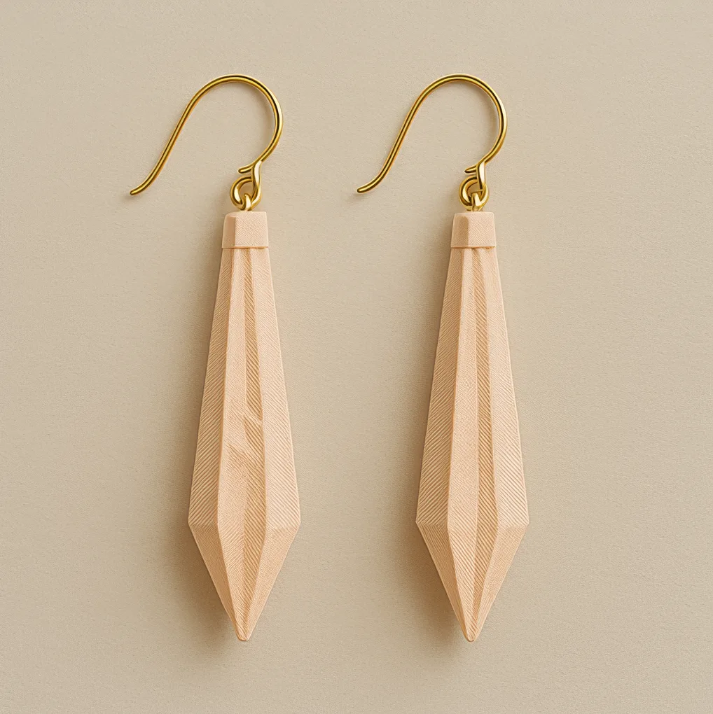 Long gold dangle earrings – 3D printed drop design with geometric nude charm